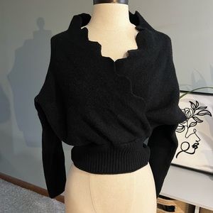 Black off the shoulders sweater with scallop edge neck. Never worn.